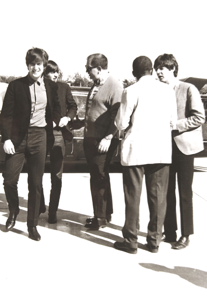 Beatles boarding plane in Milwaukee.